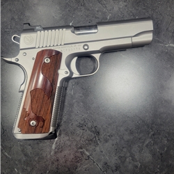The Bull Commander 45 ACP Unique Front Strap Treatment with a Matching one piece Mainspring Housing and Magwell. This custom build has a bull barrel and the bull nosed slide. the slide is naked and clean with only the nighhawk moonhawk logo behind the rear coarse cocking serrations. othe features include our new tactical curved slide stop, bevel and recessed slide stop, hienie ledge rear tritium sight and NH tritium front sights, short solid trigger, and a cera kote elite smoke finish! with stainless steel upgrade.